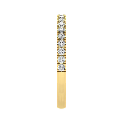 Round prong set lab grown diamond half eternity band ring featuring round diamonds in an elegant stackable wedding band design in yellow gold