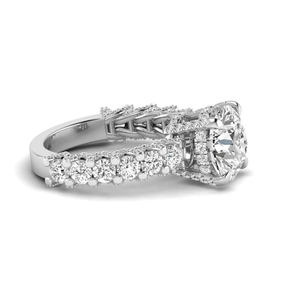 Round prong set lab grown diamond hidden halo engagement ring featuring a 9.45 mm round center diamond with pavé cathedral band and graduated round side diamonds in white gold