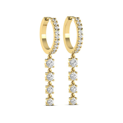 Round cut prong set lab grown diamond hoop drop earrings featuring a diamond accented hinged hoop with a graduated linear drop in yellow gold tone.