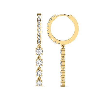 Round cut prong set lab grown diamond hoop drop earrings featuring a diamond accented hinged hoop with a graduated linear drop in yellow gold tone.
