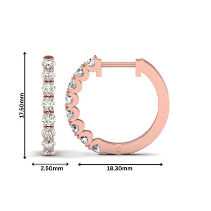Round prong set lab grown diamond hoop earrings featuring brilliant round cut diamonds in a rose gold finish with a hinged closure.