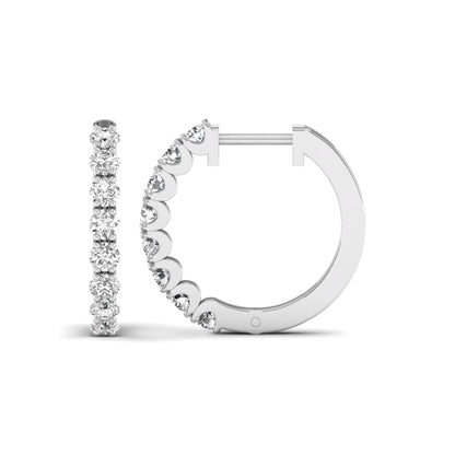 Round prong set lab grown diamond hoop earrings featuring brilliant round cut diamonds in a white gold finish with a hinged closure.