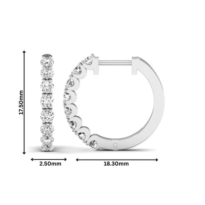 Round prong set lab grown diamond hoop earrings featuring brilliant round cut diamonds in a white gold finish with a hinged closure.