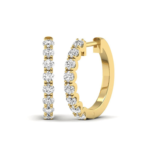 Round prong set lab grown diamond hoop earrings featuring brilliant round cut diamonds in a yellow gold finish with a hinged closure.