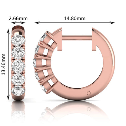 Round cut lab grown diamond front-facing huggie hoop earrings featuring a shared four prong setting, hinged snap closure, and polished rose gold finish.