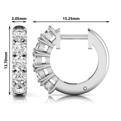 Round cut lab grown diamond huggie hoop earrings featuring five front-facing diamonds in a shared four prong setting with a hinged snap closure and polished white gold finish.