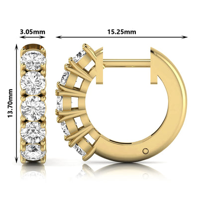 Round cut lab grown diamond huggie hoop earrings featuring five front-facing diamonds in a shared four prong setting with a hinged snap closure and polished yellow gold finish.