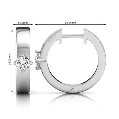 Round cut lab grown diamond huggie hoop earrings featuring a four prong setting and hinged snap closure shown in white gold tone with a polished finish.
