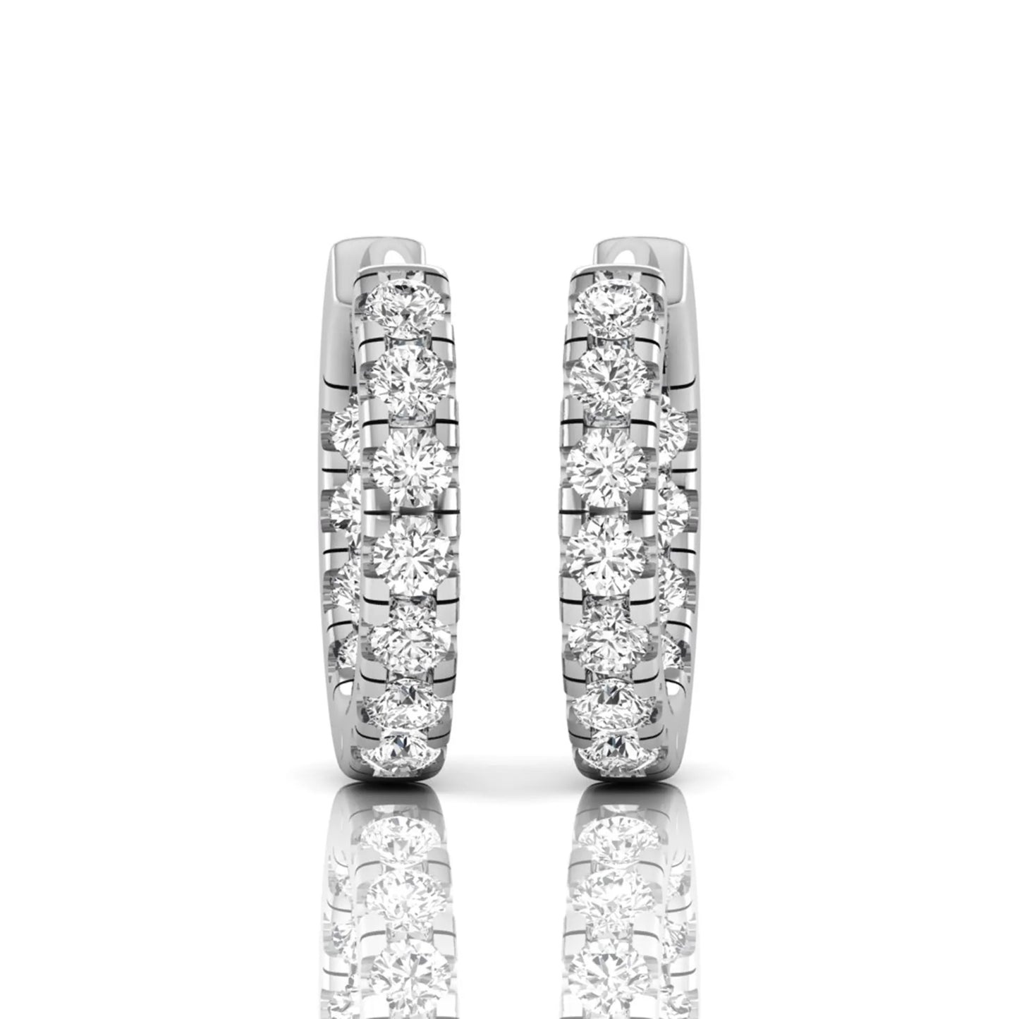 Round prong set lab grown diamond huggie hoop earrings featuring round cut diamonds in a classic hinged hoop design with white gold tone shown for display.