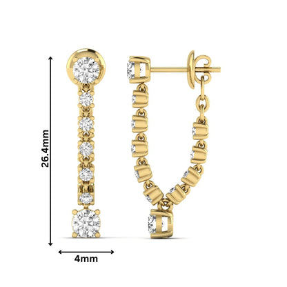 Round prong set lab grown diamond linear drop earrings featuring graduated round diamonds in a yellow gold finish with push back closure.