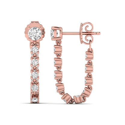 Round prong set lab grown diamond linear drop earrings featuring graduated round cut diamonds in a rose gold finish with push back closure.