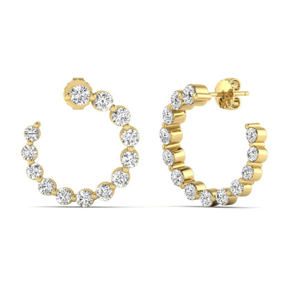 Round prong set lab grown diamond open hoop earrings featuring brilliant round cut diamonds in a yellow gold finish with push back closure.