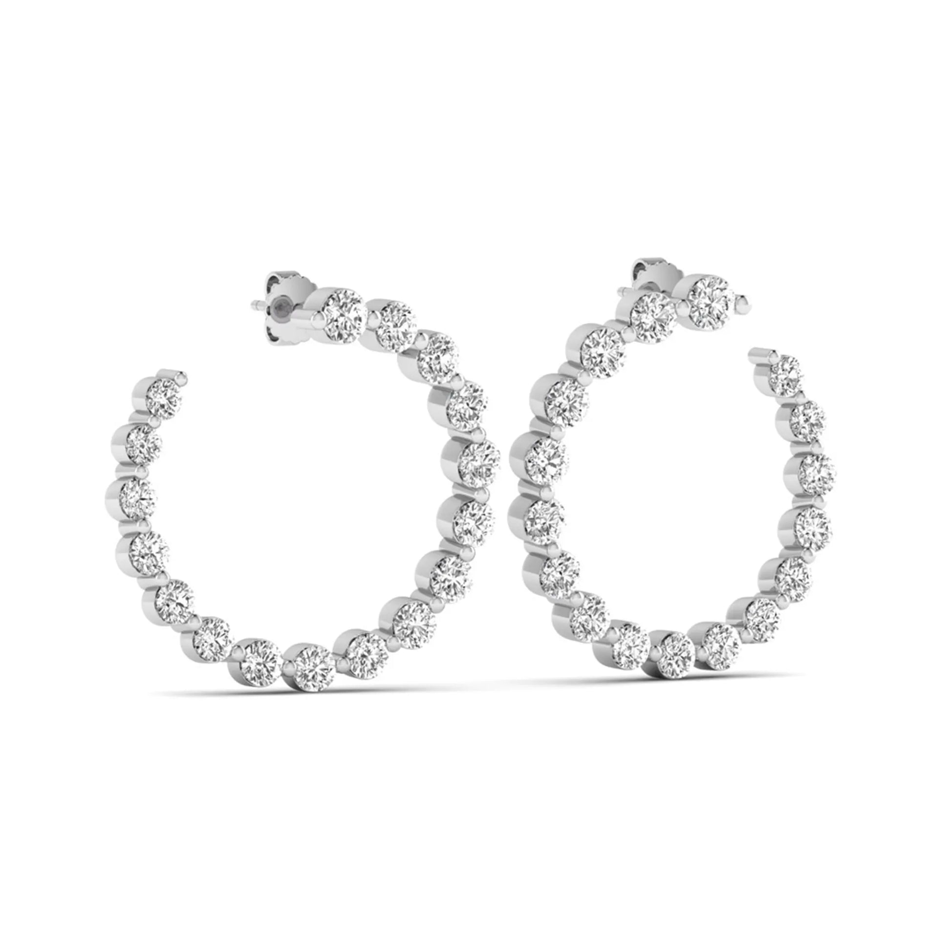 Round prong set lab grown diamond open hoop earrings featuring brilliant round cut diamonds in a white gold finish with push back closure.