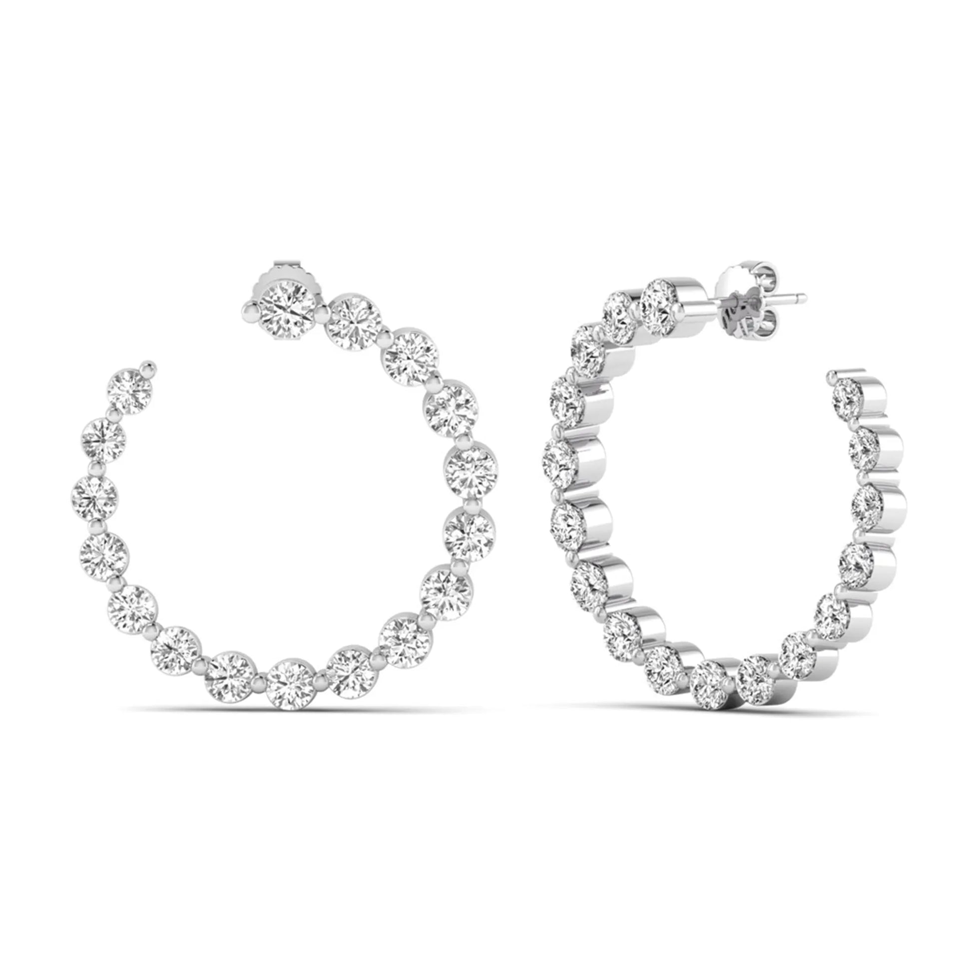 Round prong set lab grown diamond open hoop earrings featuring brilliant round cut diamonds in a white gold finish with push back closure.