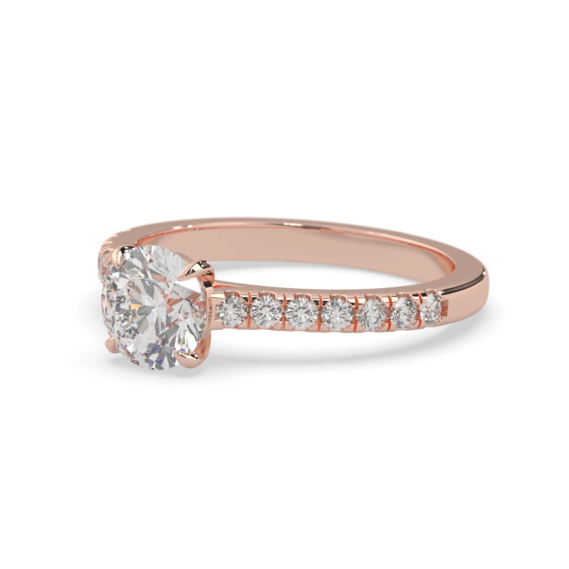 rose gold Round cut lab grown diamond prong set engagement ring with pavé band and yellow metal tone design