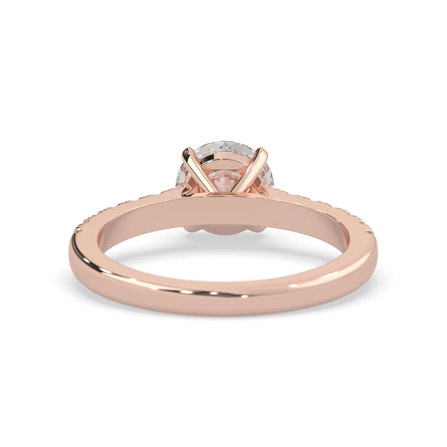 rose gold Round cut lab grown diamond prong set engagement ring with pavé band and yellow metal tone design