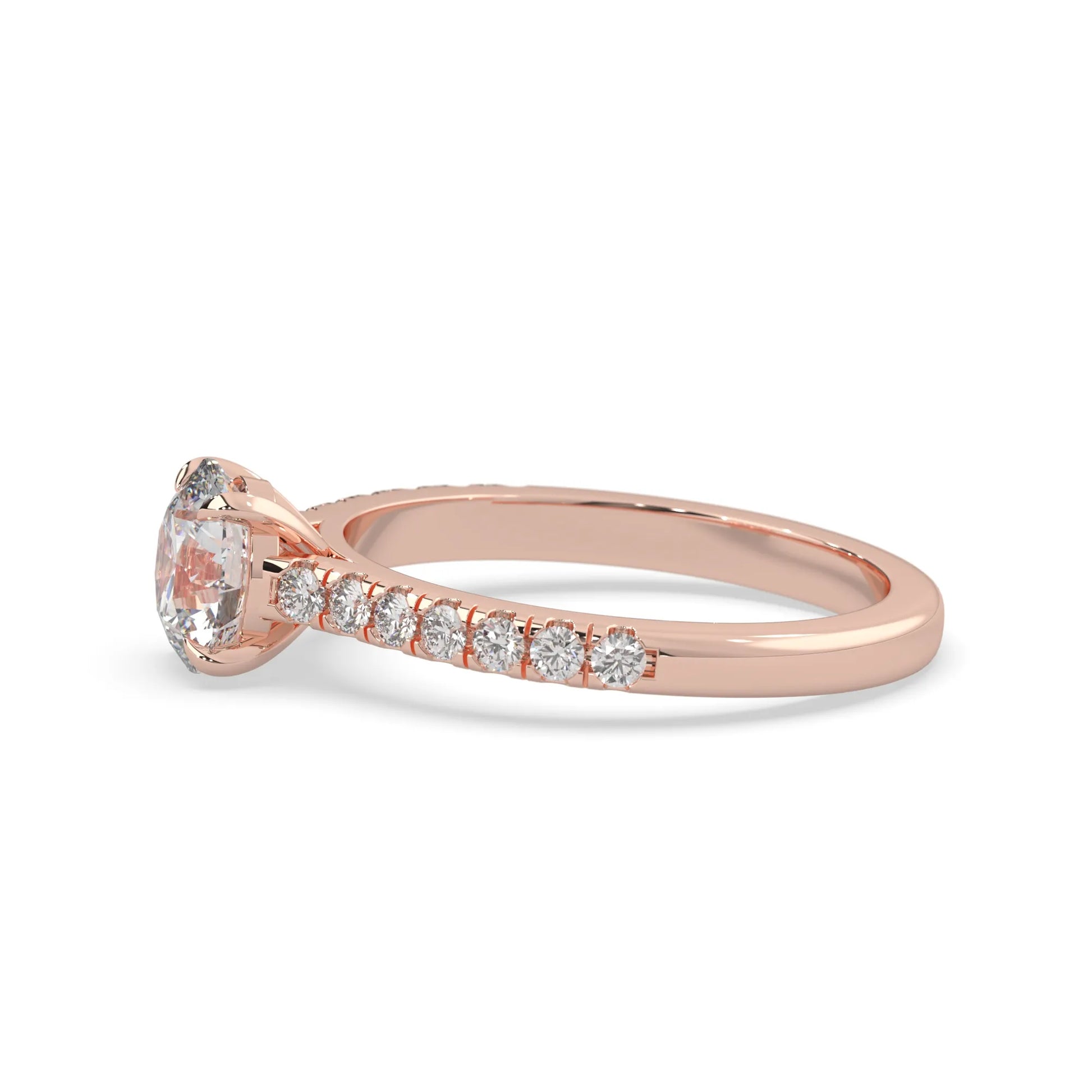 rose gold Round cut lab grown diamond prong set engagement ring with pavé band and yellow metal tone design