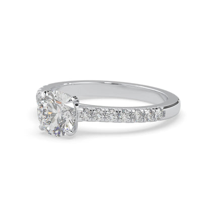 white gold Round cut lab grown diamond prong set engagement ring with pavé band and yellow metal tone design