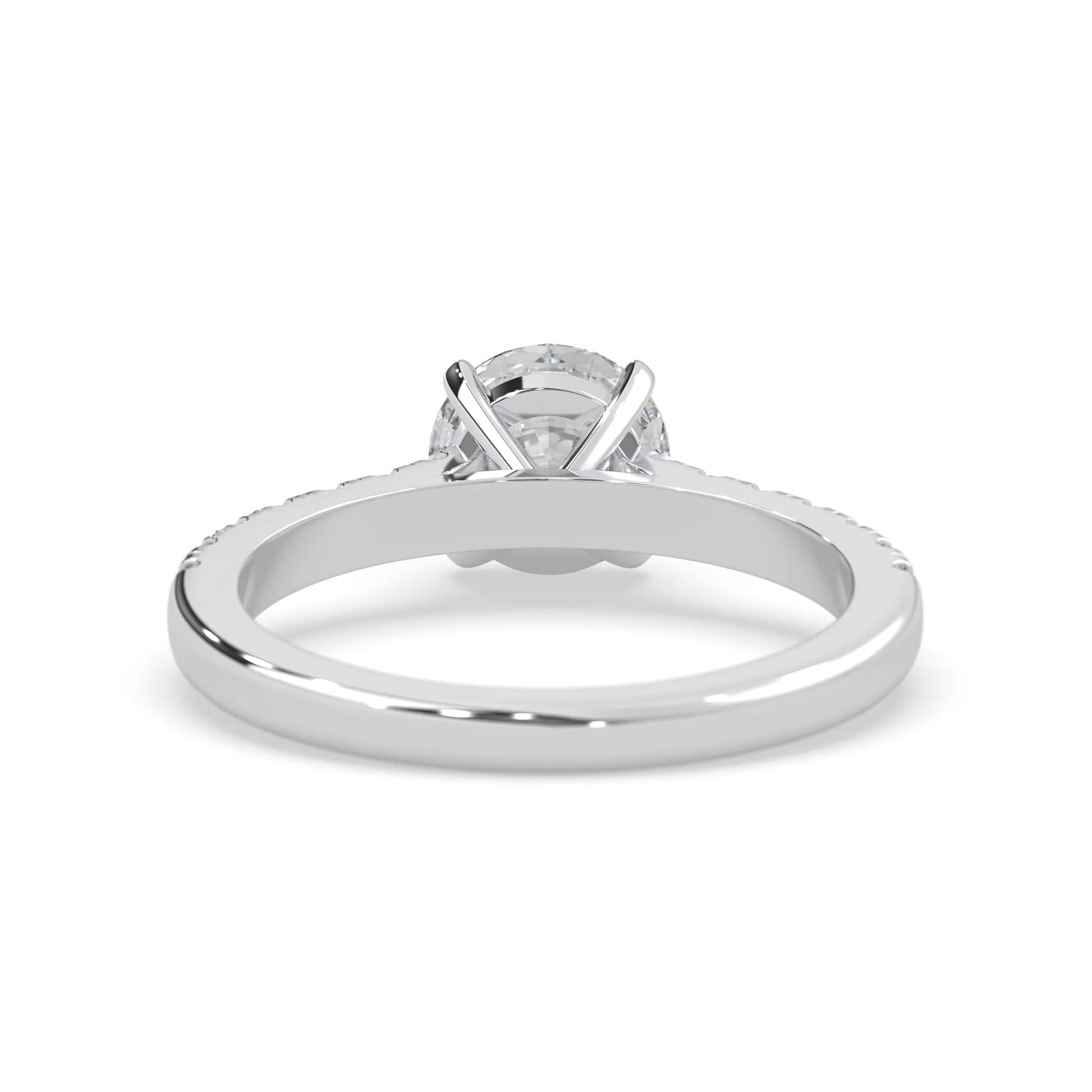 white gold Round cut lab grown diamond prong set engagement ring with pavé band and yellow metal tone design