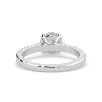 white gold Round cut lab grown diamond prong set engagement ring with pavé band and yellow metal tone design