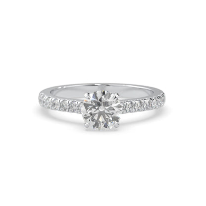 white gold Round cut lab grown diamond prong set engagement ring with pavé band and yellow metal tone design