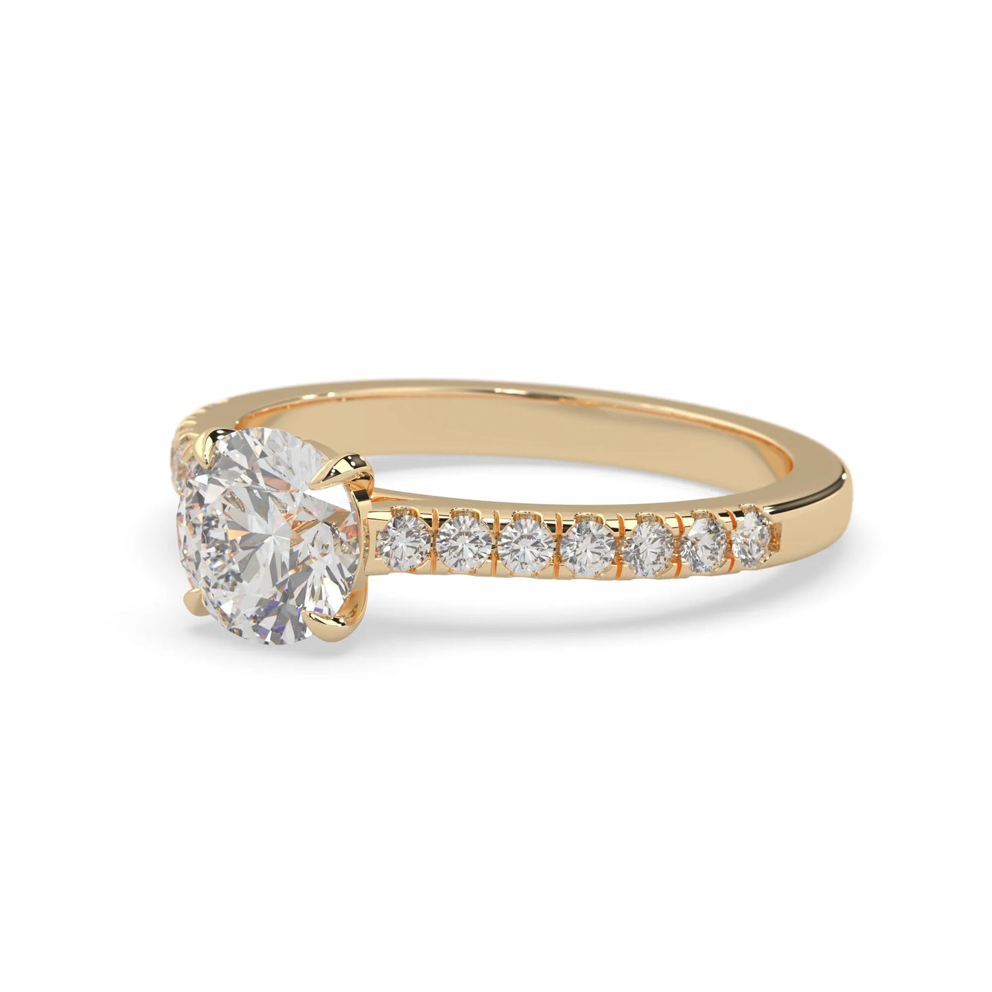 yellow gold Round cut lab grown diamond prong set engagement ring with pavé band and yellow metal tone design