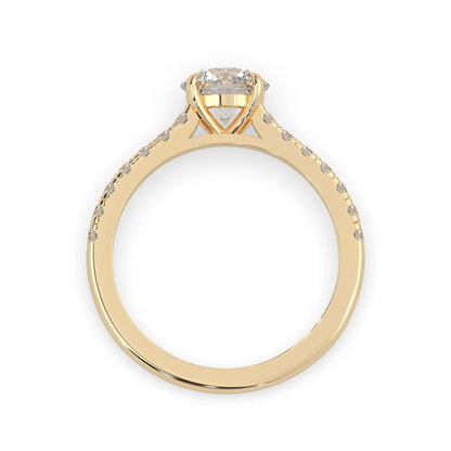 yellow gold Round cut lab grown diamond prong set engagement ring with pavé band and yellow metal tone design
