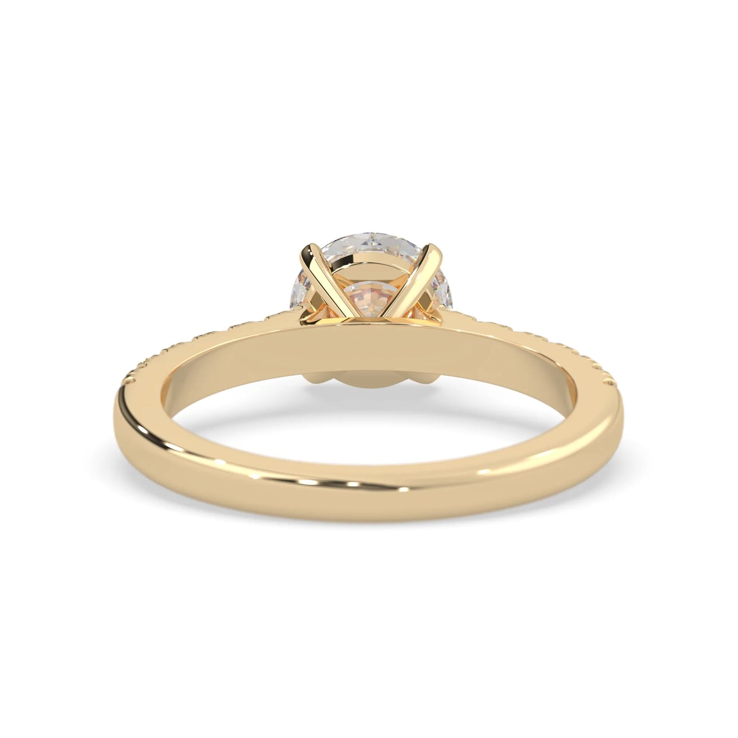 yellow gold Round cut lab grown diamond prong set engagement ring with pavé band and yellow metal tone design