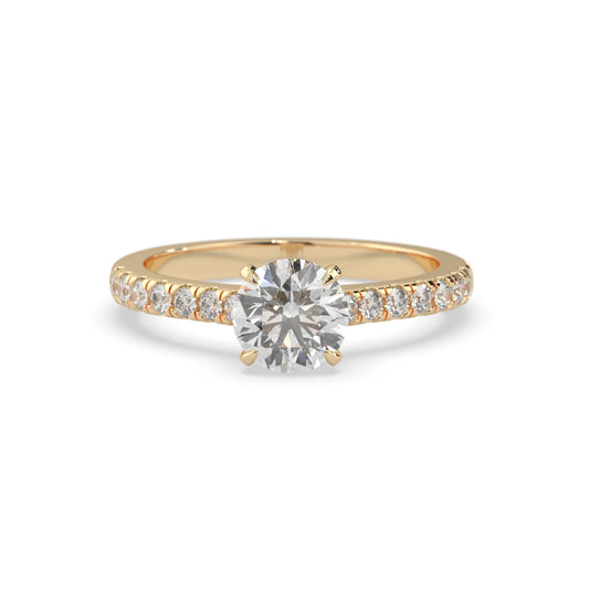 yellow gold Round cut lab grown diamond prong set engagement ring with pavé band and yellow metal tone design