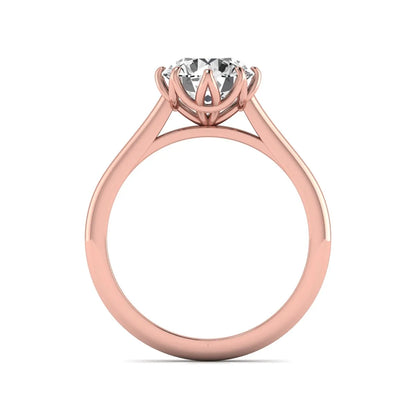 Round cut lab grown diamond solitaire engagement ring featuring a six-prong setting and polished rose gold tone band.