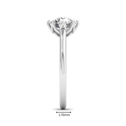 Round cut lab grown diamond solitaire engagement ring featuring a six-prong setting and polished white gold tone band.