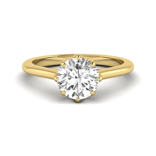 Round cut lab grown diamond solitaire engagement ring featuring a six-prong setting and polished yellow gold tone band.