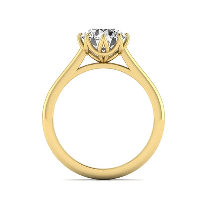 Round cut lab grown diamond solitaire engagement ring featuring a six-prong setting and polished yellow gold tone band.