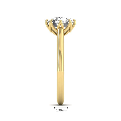 Round cut lab grown diamond solitaire engagement ring featuring a six-prong setting and polished yellow gold tone band.
