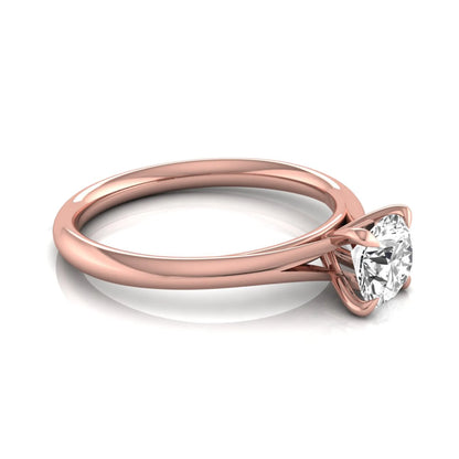 Round prong set lab grown diamond solitaire engagement ring featuring a 0.70 carat round center diamond in a classic four-prong setting in rose gold