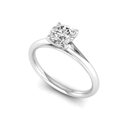 Round prong set lab grown diamond solitaire engagement ring featuring a 0.70 carat round center diamond in a classic four-prong setting in white gold
