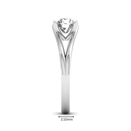 Round cut lab grown diamond solitaire split shank engagement ring with classic prong setting and white gold tone shown for design reference.