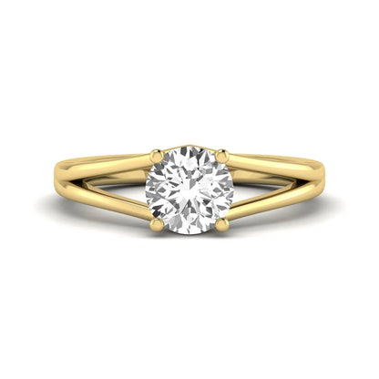 Round cut lab grown diamond solitaire split shank engagement ring with classic prong setting and yellow gold tone shown for design reference.
