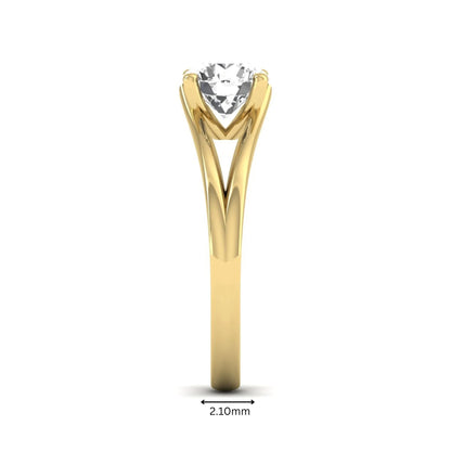 Round cut lab grown diamond solitaire split shank engagement ring with classic prong setting and yellow gold tone shown for design reference.