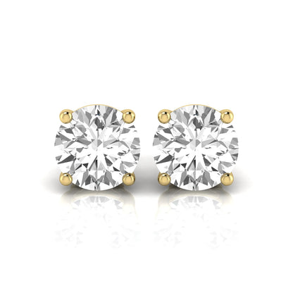Round cut lab grown diamond stud earrings featuring a classic four-prong setting with secure screw back closure in a yellow gold tone.