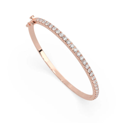 rose gold Round cut prong set lab grown diamond tennis bangle bracelet featuring a sleek polished design.