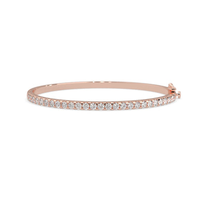 rose gold Round cut prong set lab grown diamond tennis bangle bracelet featuring a sleek polished design.