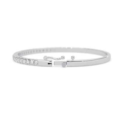 white gold Round cut prong set lab grown diamond tennis bangle bracelet featuring a sleek polished design.