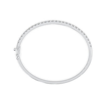 white gold Round cut prong set lab grown diamond tennis bangle bracelet featuring a sleek polished design.