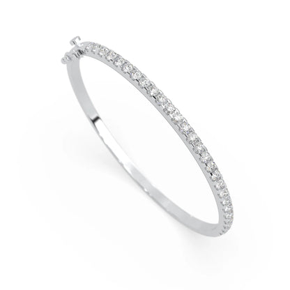 white gold Round cut prong set lab grown diamond tennis bangle bracelet featuring a sleek polished design.