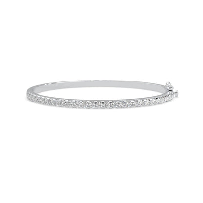 white gold Round cut prong set lab grown diamond tennis bangle bracelet featuring a sleek polished design.