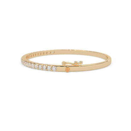 yellow gold Round cut prong set lab grown diamond tennis bangle bracelet featuring a sleek polished design.
