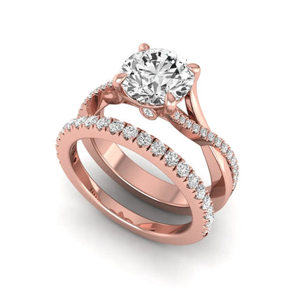 Round prong set lab grown diamond twisted shank bridal ring set featuring a 2.00 carat round center diamond with pavé round side diamonds in rose gold finish.