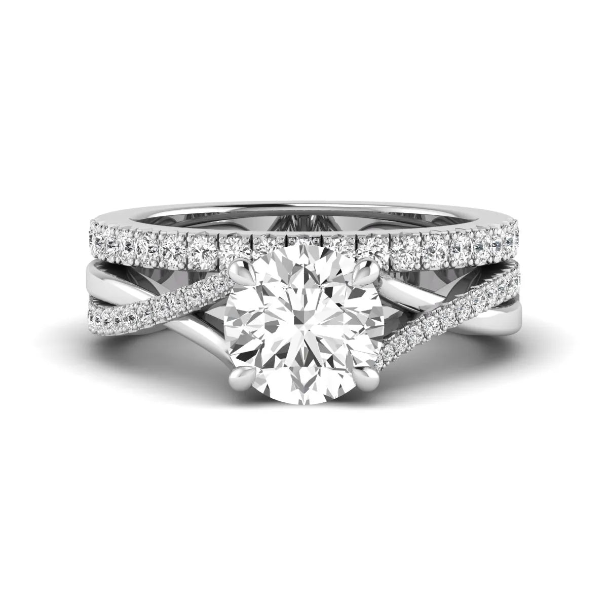 Round prong set lab grown diamond twisted shank bridal ring set featuring a 2.00 carat round center diamond with pavé round side diamonds in white gold finish.