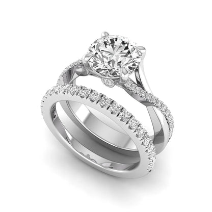 Round prong set lab grown diamond twisted shank bridal ring set featuring a 2.00 carat round center diamond with pavé round side diamonds in white gold finish.